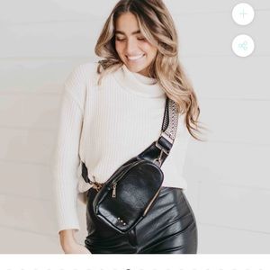 Jordan sling purse. Black with exchangeable, adjustable  guitar strap.